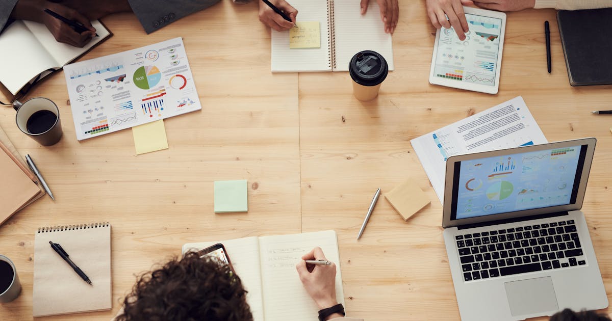 Team collaborating on unified business dashboard