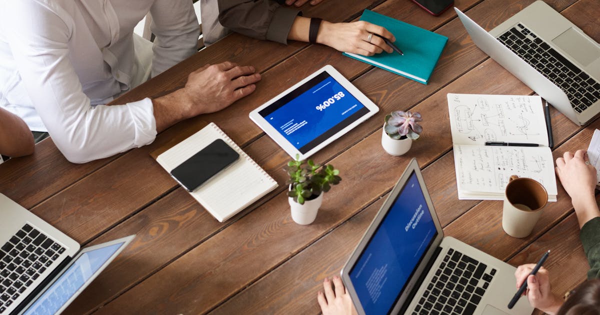 Cost comparison chart showing per-user vs per-client pricing models at different team sizes